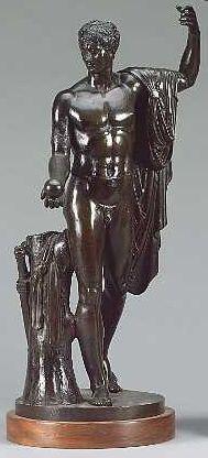 A 19th century French or Italian bronze figure of a semi-clad classical male