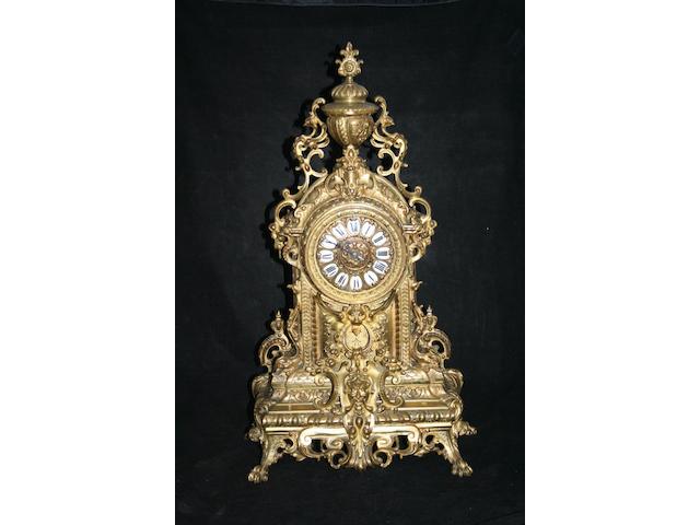 A large late 19th Century French gilt-bronze mantel clock garniture set,