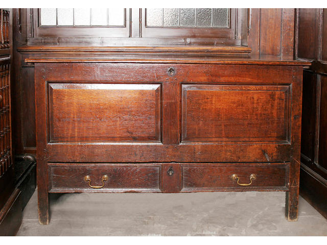 An early 18th century oak twin panel mule chest,