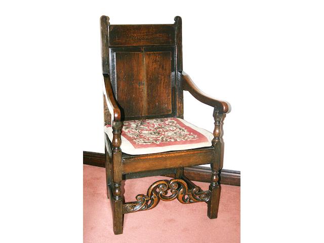 An 18th century and later oak Wainscot elbow chair,
