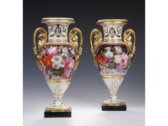 A pair of two handled white and gilt vases, possibly Coalport Circa 1815 - 1820