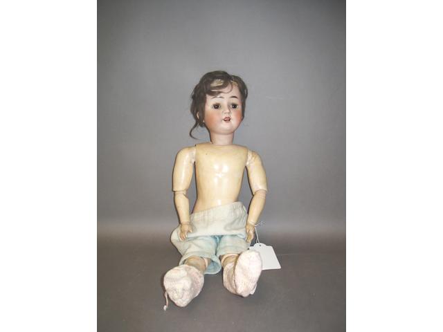 Bisque head girl doll, circa 1910,