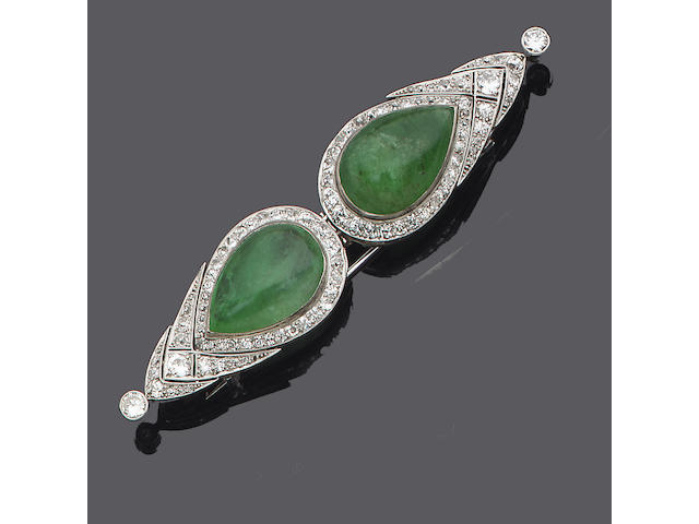 An art deco emerald and diamond double-clip brooch,