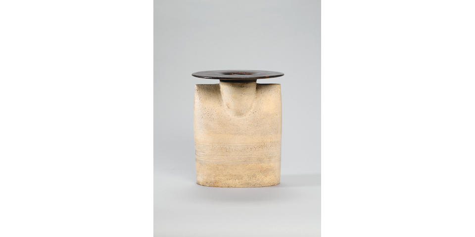Hans Coper a large flattened Form with disc-top, circa 1974 Height 21cm (8 1/4in.)