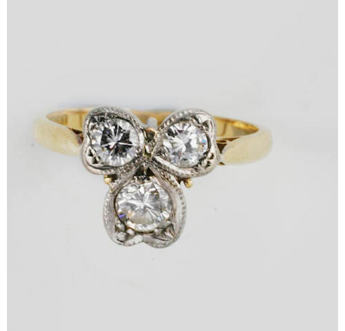 A diamond cloverleaf ring,