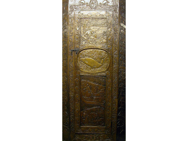 A late 19th Century carved oak corner cupboard