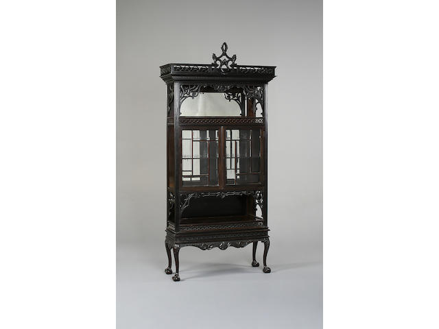 A late 19th Century ebonised display cabinet,