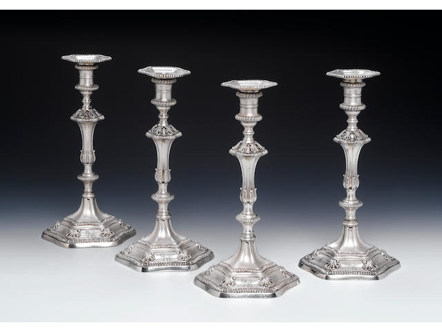 A set of four George III cast silver candlesticks, maker's mark WC, London 1771,  (4)