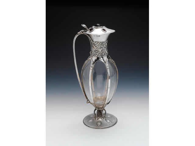 An Edwardian silver-mounted claret jug, by Omar Ramsden and Alywn Carr, London 1905,