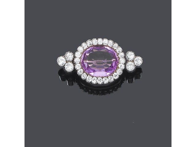 An early 20th century pink topaz and diamond brooch,