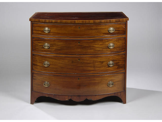 A Regency mahogany and boxwood chequer strung bow fronted chest,