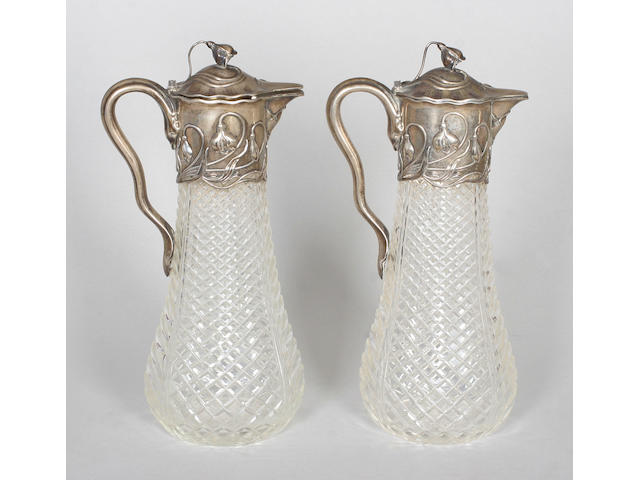 A pair of German Art Nouveau claret jugs Stamped '800', circa 1900,
