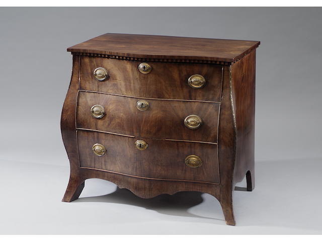 A late 18th Century Dutch mahogany bombe commode With dentil frieze above three long drawers, on swept bracket feet, 95cm wide.
