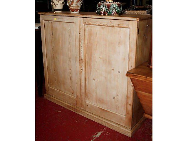 A 19th Century stripped pine cupboard