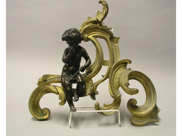 A pair of bronze and ormolu chenets in the Louis XV style