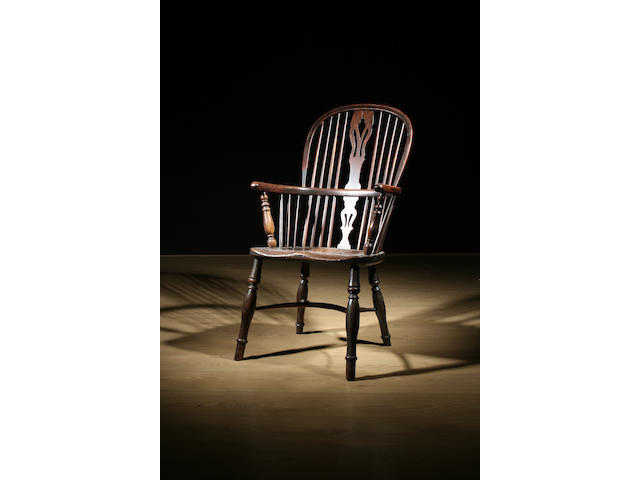 A mid-19th Century yew, ash, beech and elm high Windsor chair