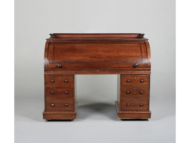 A Victorian mahogany cylinder pedestal desk