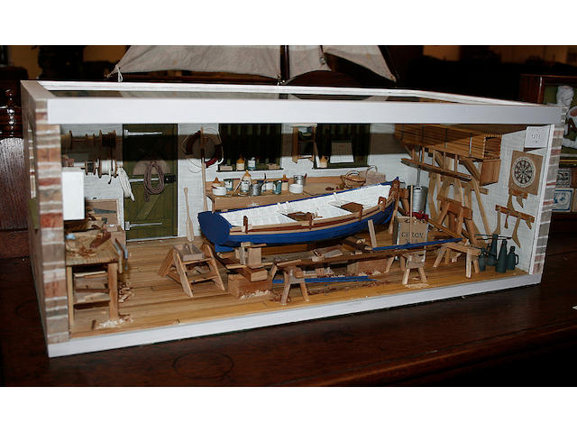 A highly detailed diorama of a boat builder's workshop,