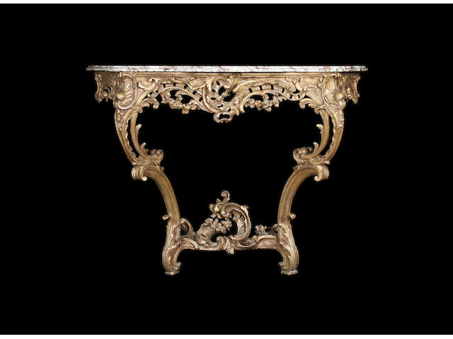 A late 19th/early 20th century carved giltwood and composition console table