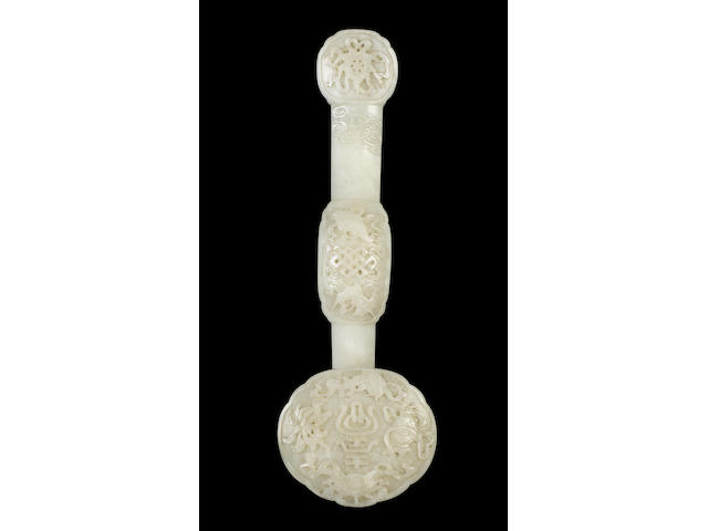 A mottled white jade ju-i sceptre of typical 'Dragon Constellation' form;