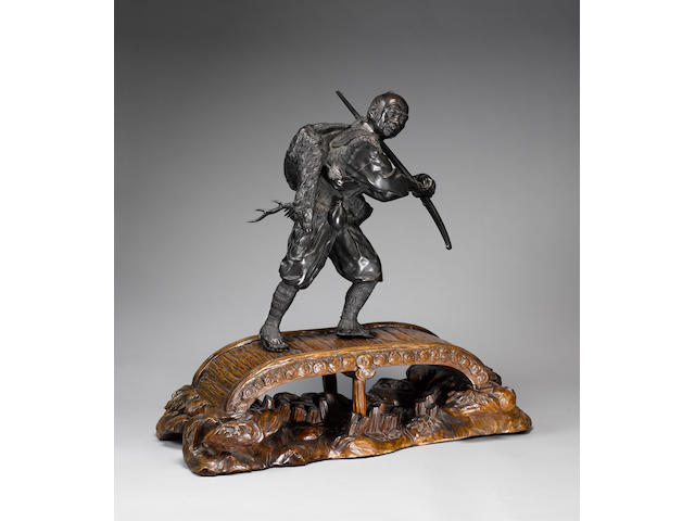 An impressive Tokyo School bronze okimono of a hunter,