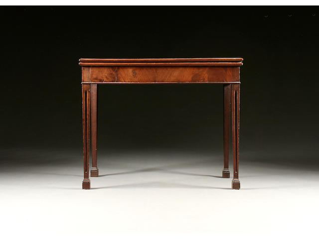 A mid George III mahogany fold over tea table,