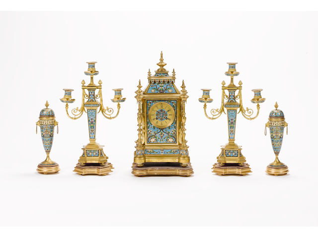 A late 19th century French champleve enamel decorated clock garniture Retailed by E.W. Streeter, 37 Conduit St. London