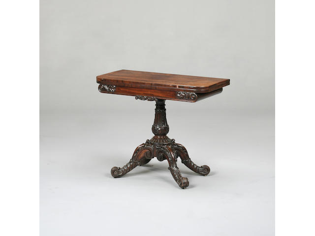 A Victorian carved rosewood card table