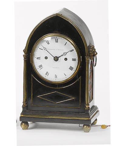 An early 19th century ebonised lancet clock of small size Grayhurst and Harvey, London