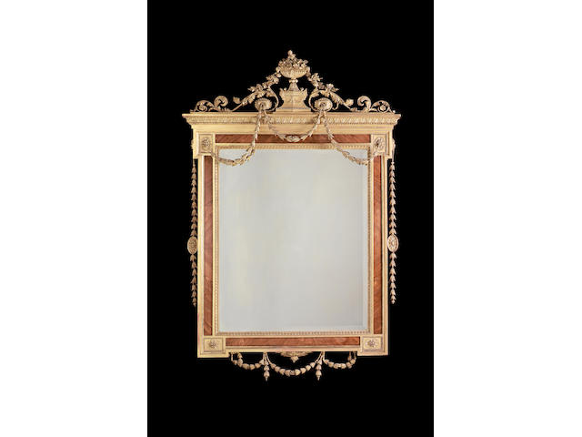 A Neo-Classical style tulipwood and gilt composition mirror