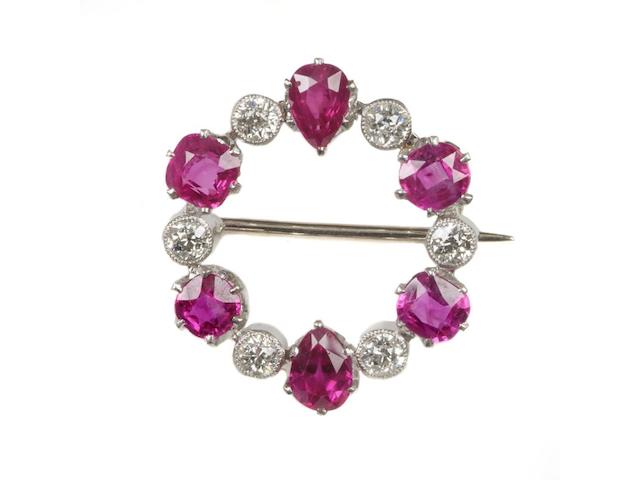 A ruby and diamond hoop brooch