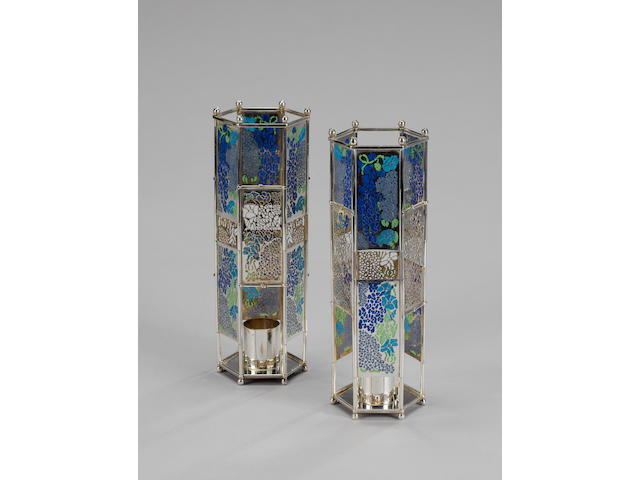 FRANCES LOYEN : A pair of silver and plique-&#224;-jour enamelled candlesticks, London 1985,