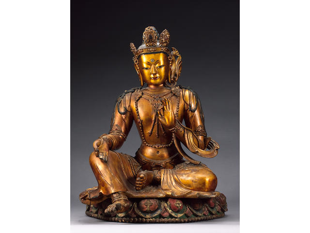 A Sino-Tibetan carved giltwood Deity,