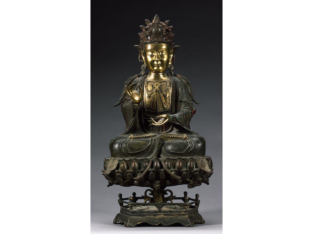 A Chinese bronze and gilt bronze seated figure of Guanyin,