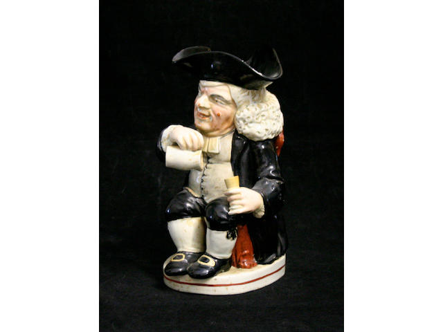 A 'Drunken Parson' Toby jug, circa 1820-30