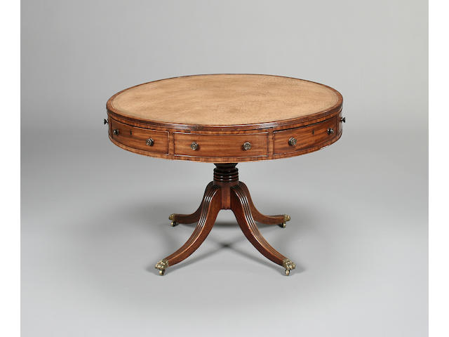 A Regency mahogany drum top library table