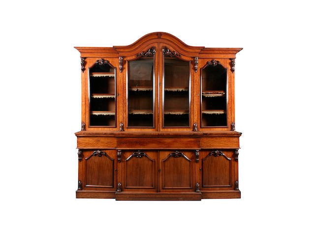 A Victorian figured mahogany breakfront secretaire bookcase