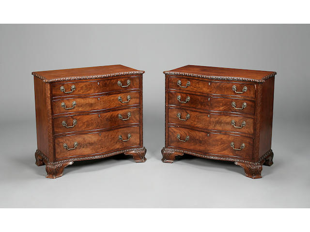 A pair of mahogany serpentine chests