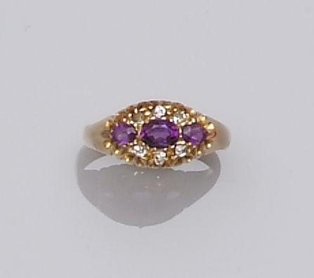 An Edwardian amethyst and diamond ring (2)