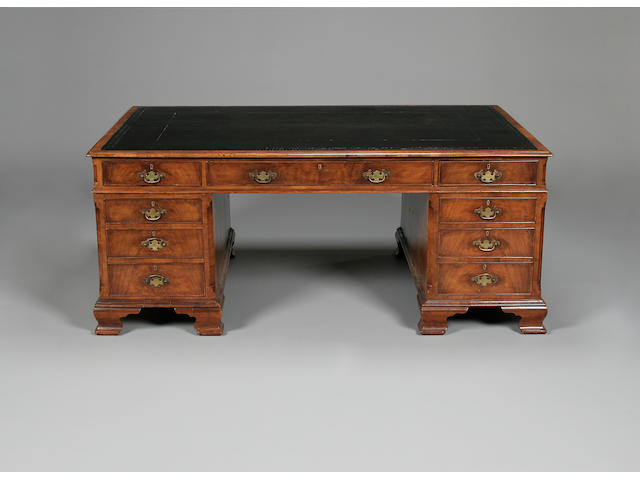 A  Victorian walnut pedestal partners desk