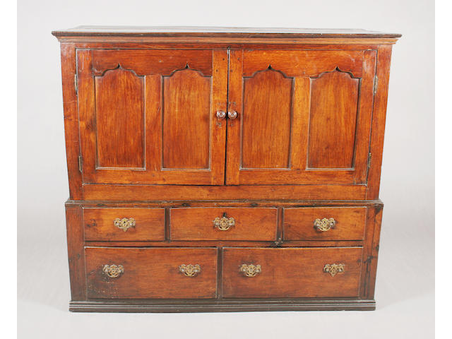 A mid-18th century Welsh oak press cupboard of low proportions