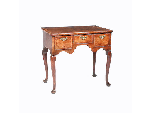 An 18th century walnut veneered and crossbanded lowboy,