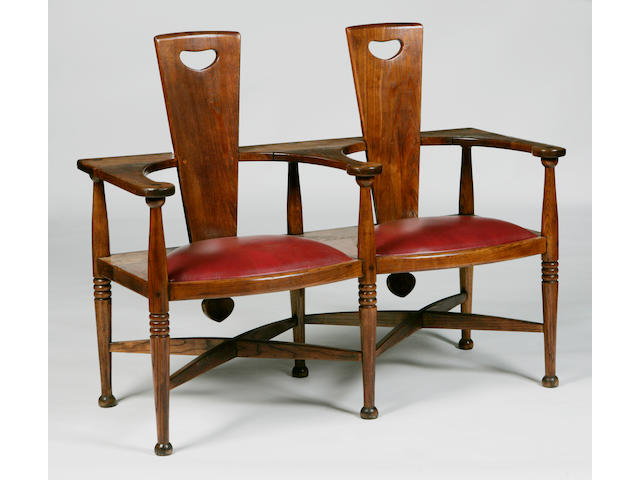 In the manner of George Walton an Arts & Crafts oak settle