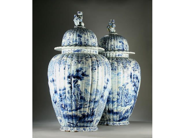 A massive pair of Dutch Delft vases and covers