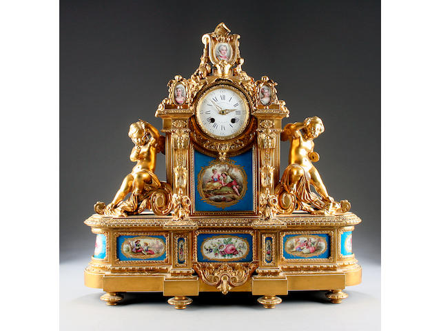 A good mid 19th Century porcelain-mounted ormolu mantel clock Raingo Freres, Paris sold with two winders, pendulum and ebonised plinth