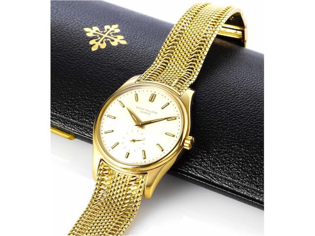Patek Philippe. A very fine and extremely rare 18ct gold wristwatch with enamel dial and rare luminous indexes, original 18ct gold Patek Philippe bracelet, together with Patek Philippe presentation box, 5 unused period Patek Philippe leather straps in assorted colours, one with an 18ct gold Patek Philippe buckle, original Certificate of Origin and an Extract from the ArchivesRef: 2526, 4th Generation, Case No. 2601114, Movement No.764043, Made in 1956, Sold February 28th 1958