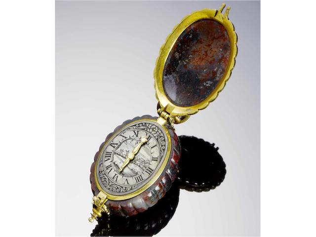 German. A fine and exceptionally rare pre-balance spring single-hand pendant watch in a carved Heliotrope case circa 1640