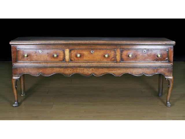 A mid 18th Century oak low dresser