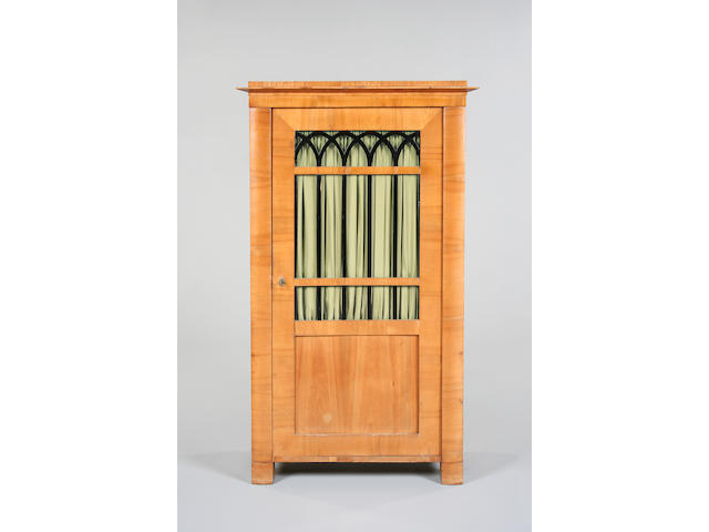 A Biedermeier style birch cabinet,