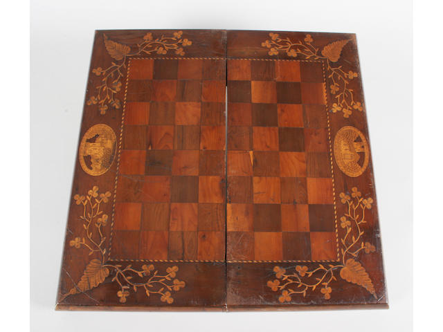 A mid-19th century Irish arbutus and yew veneered and boxwood inlaid chess and backgammon board/box